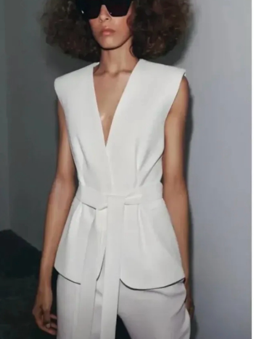 Sleek Sleeveless White Belted Vest Top